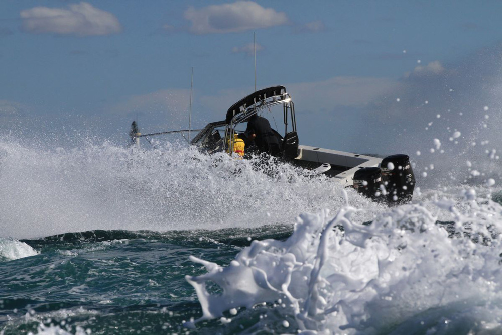 boat driving through dangerous choppy waters