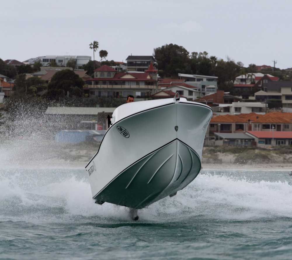 Tidal marine hull with bow flare