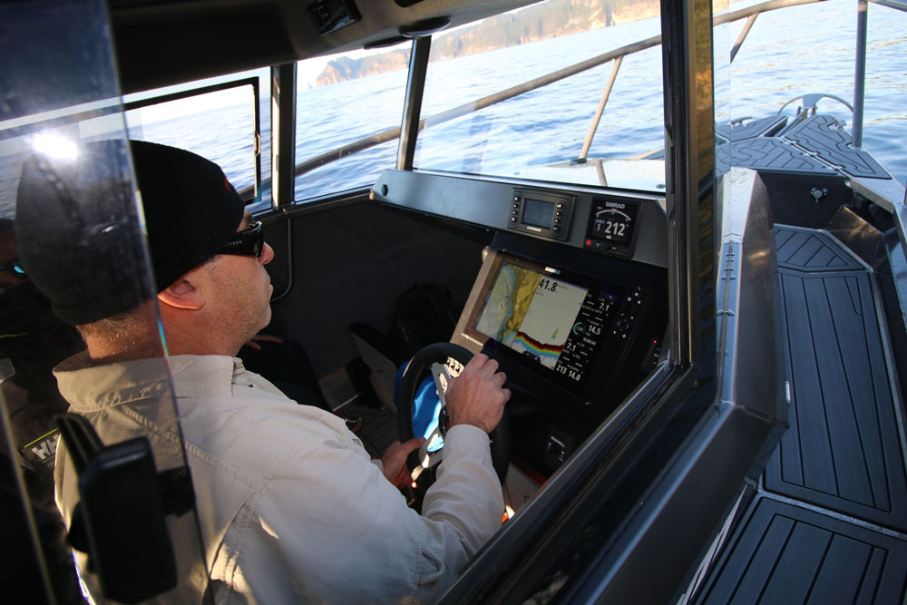 The cabin provides excellent visibility and a small but efficient helm