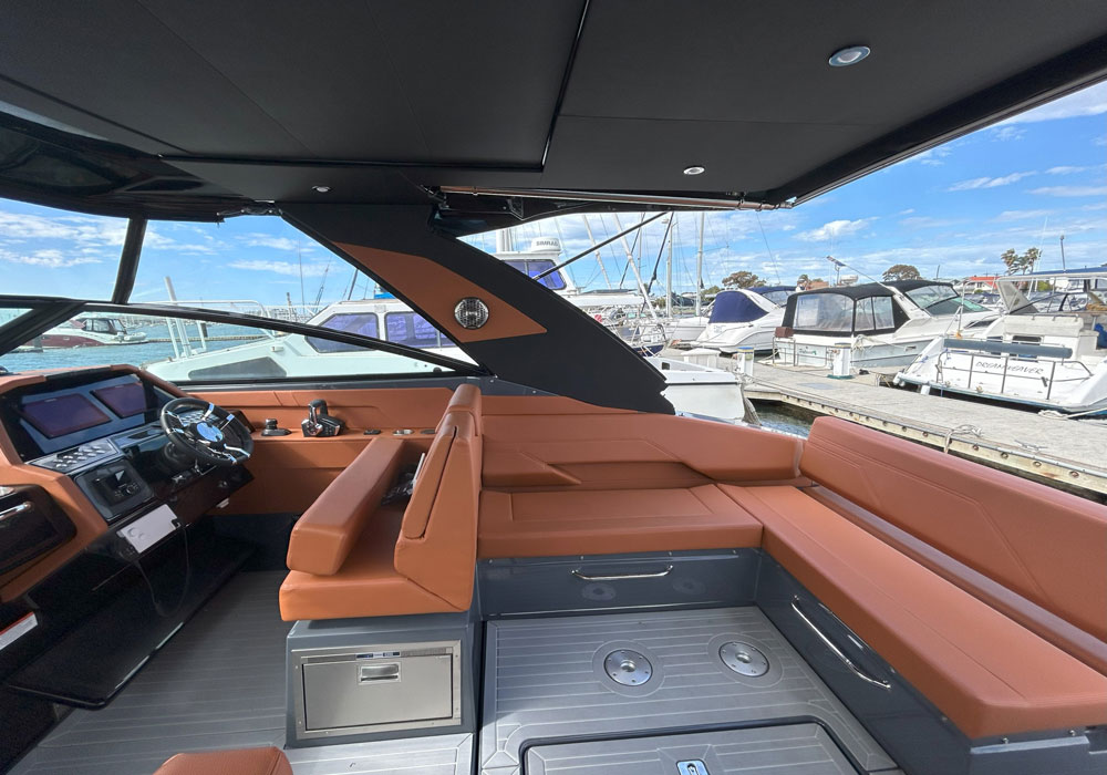 The Cruisers 34GLS cockpit features L shaped seating areas and a double helm/forward position