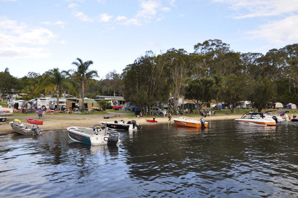 Boats and campers at Wallaga Lake